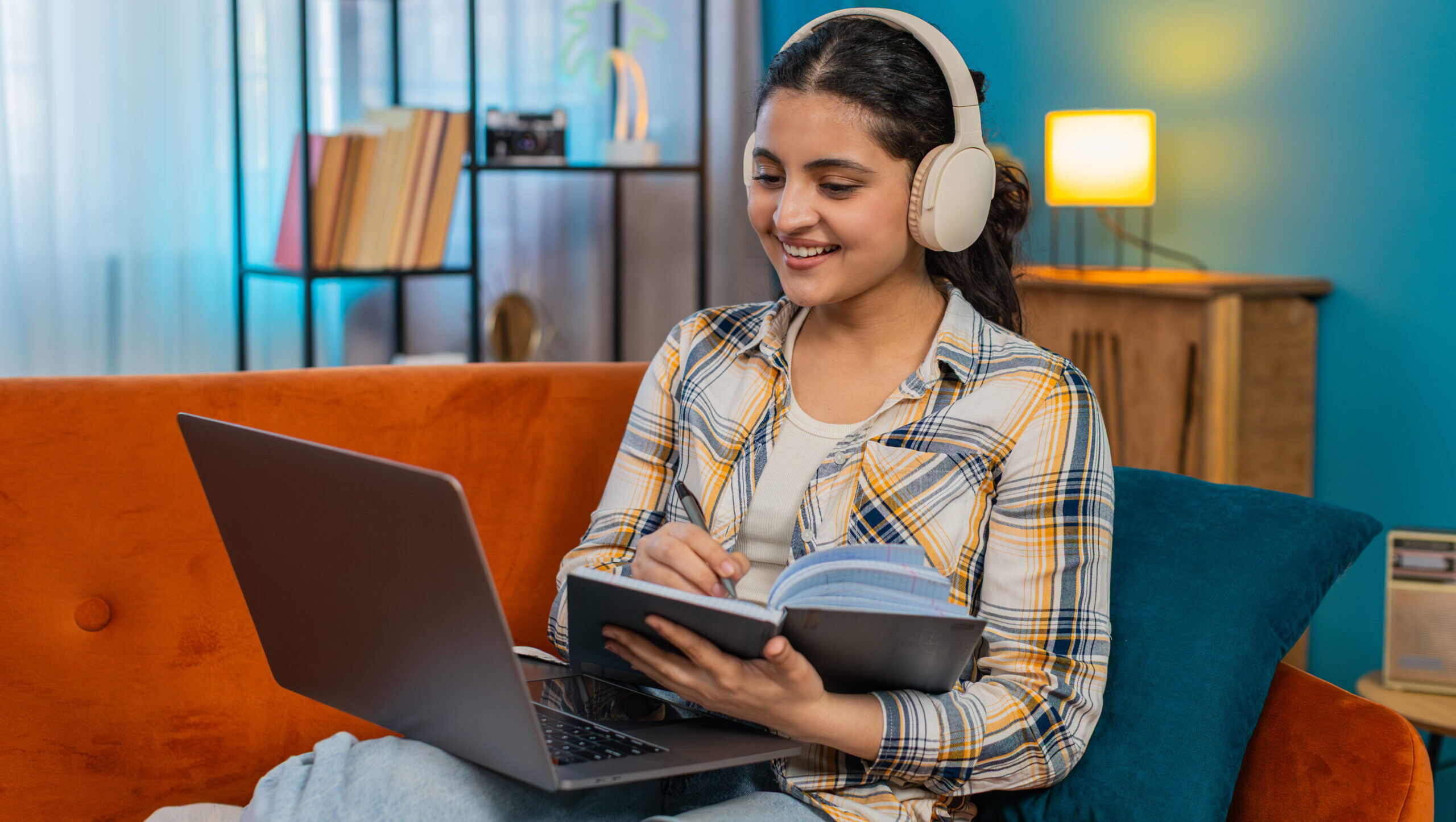 Student studying online with headphones